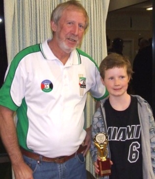 Presenting the Doug McLaggan bowling award to junior Dillon Barrett in 2013.